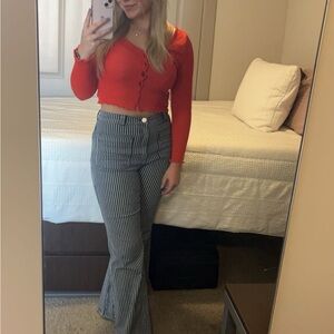 Red Button-Up Cardigan and Striped Flare Pants
